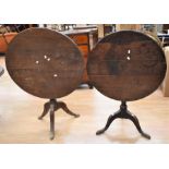 Two 18th Century tilt top tables on tripod legs in oak