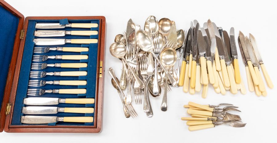 A mid 20th Century cased canteen of fish knives along with other loose silver plated flat wares