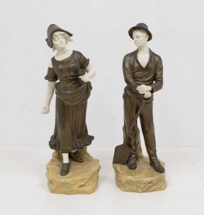 A pair of early 20th century Austrian Figures of a man holding a spade, the woman scattering