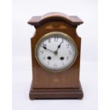 An Edwardian mantel clock with two-train sprung French movement striking on a gong with 4.5"