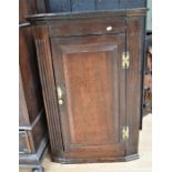 George III oak corner cupboard with three internal shelves