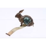 A Gilt brass and celluloid Novelty tape measure in form of a rabbit. Tape is 100cm and complete.