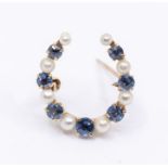 A small and sapphire and pearl 14ct gold brooch, comprising alternate round cut sapphires and