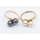 Two pearl and gold rings, comprising an 18ct gold cross over ring set with two black pearls, size N,