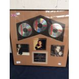 Framed CD's of Michael Bolton, as presented to him by Columbia Records for combined record sales