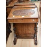 Victorian walnut Davenport, the raised top with brass gallery inset leather writing surface dummy