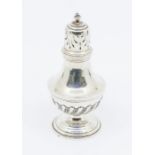 A Victorian silver baluster caster, wyvern fluted lower section, pierced domed cover with urn