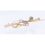 An Art Nouveau stone set gold bar brooch, cross over design with wire decoration set pearl and