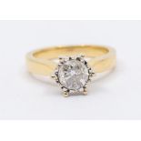 A diamond and 18ct gold solitaire ring, comprising a round brilliant cut diamond weighing approx