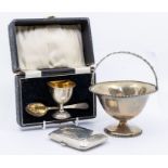 A group of silver to include: George V silver egg cup and spoon, by WD, Birmingham, 1922, cased;