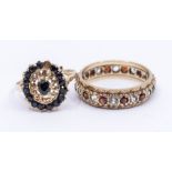 A garnet and white spinel set 9ct gold eternity, with alternating stones, size P, along with a