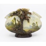An early 20th Century earthenware tulip style vase, oval body applied with tree and bocage in high