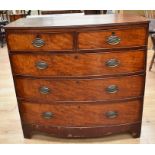 George III mahogany bow front chest of two above three drawers with brass swing handles on bracket