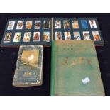 A full Wills cigarette card album; an Enid Blyton holiday book and vintage road map