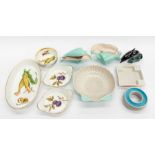 A collection of mid 20th Century Poole Pottery including ashtray, dish, dolphin, along with
