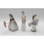 Three Lladro figures of two young ladies and a Chinese girl