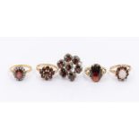 A garnet and diamond 18ct oval cluster ring, size M, total gross weight approx 4.0gms, a 9ct oval
