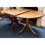 A George III revival mahogany pedestal dining table, twin D-end pedestals tilt top with fluted end
