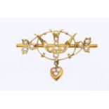 A late Victorian pearl set 15ct gold swallow brooch, central swallow within a wirework border of
