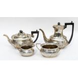 A Georgian style four piece silver tea and coffee service, gadroon lower section, comprising teapot,