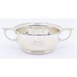 An Edwardian silver porringer, wavy rim with geometric handles, engraved Barbara 26th January 1923