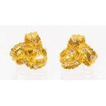 A pair of diamond mid century diamond and gold earrings, textured interwoven leaf motifs