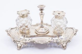 An early Victorian silver ink stand, shaped stand with scrolling border and pierced decoration, on