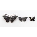 Olaf Fritjof Hjortdahl- a set of three black enamel and  silver gilt Modernist  butterfly brooches