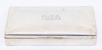 A George V silver table cigarette box, engraved initials G.E.A, hallmarked Birmingham 1918, cedar
