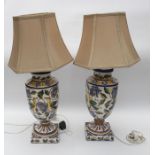A pair of Continental style large baluster shaped table lamps, the bodies painted with birds and