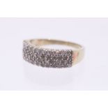 A diamond and 9ct gold set half eternity ring, set to the front with four rows of round brilliant