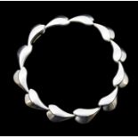 Georg Jensen- a silver 'lotus' bracelet by Per Hertz for Georg Jensen, comprising brushed links,