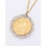 A George V sovereign dated 1912, mounted as a pendant in  a scroll border on a fine link yellow