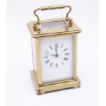 An early 20th Century brass French carriage clock with case and key