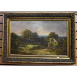 A 19th Century English School scene of a country cottage next to woodland, with figures posing, gilt