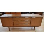 1970s teak side board, unmarked with two cupboard doors flanking three central drawers