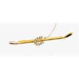 Horse Interest- A Garrard & Co 18ct two tone gold riding crop brooch with horse shoe detail set with