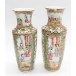 A pair of early 20th Century Famille Rose small vases, 25cms high approx Condition: chips and