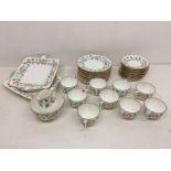A Wedgwood pattern no: 258 part tea service, white ground decorated with a band of loose flowers, to