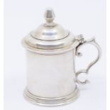 A Modern Irish silver plain mustard pot and cover, the domed cover with bud finial, S scroll handle,