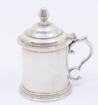 A Modern Irish silver plain mustard pot and cover, the domed cover with bud finial, S scroll handle,