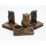 Treen: A pair of bookends modelled as owls with glass eyes on books plus a inkstand and pen holder