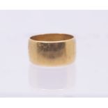 A 22ct gold wedding band, width approx 10mm, size N, weight approx 10gms
