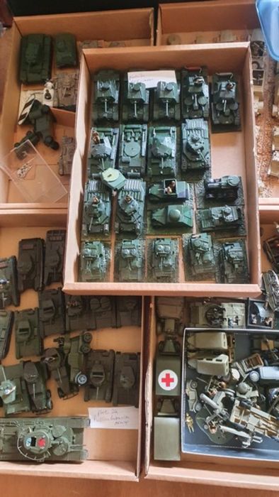 8 small boxes of Russian, British, German, Italian, tanks, lorries etc with a box of accessories.