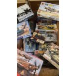 A large box of model kits, including Airfix and Italeri examples.