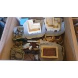 A large box of resin buildings and accessories, with a small box of plastic Russian buildings and