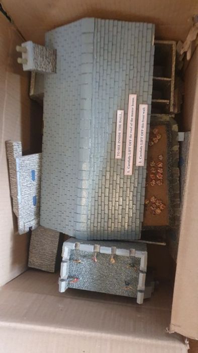4 boxes containing a model Great Hall, various bits of scenery, three big boats and also a large