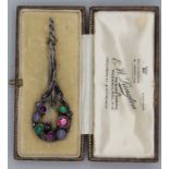 An Arts & Crafts cornet shaped brooch, set with cabochon and faceted gemstones in silver, attributed