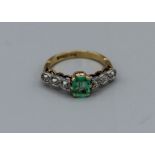 Art Deco Emerald and diamond ring in 18ct gold and platinum. Emerald has limited inclusions.
