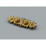 An etruscan revival style Victorian 9ct 9Chester) bar brooch. Gross approx weight 2.5gm